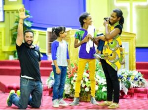 Beautiful: Ghanaian Movie star Majid Michel prays with His Family