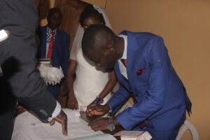 Abiodun signing the dotted line -dailyfamily.ng