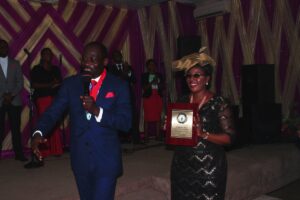 Pastor Mike Adebamowo dedicates award to his wife, Pst Mrs. Oyeyemi Adebamowo during yesterday's service -dailyfamily.ng