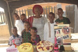 Mrs Duro-Ishola flanked by her Grandchildren