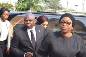 Governor Ambode and wife, Bolanle arrives the church for the funeral service