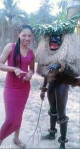 Strange! Lady poses with her village god in Photos.dailyfamily.ng