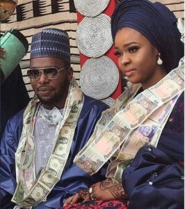 Couple Use Dollar, Naira Notes As Necklace (See Photos).dailyfamily.ng