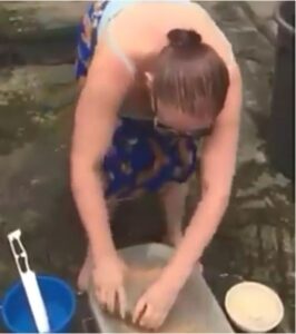 Oyinbo Woman Grinds Pepper On Stone2.dailyfamily.ng